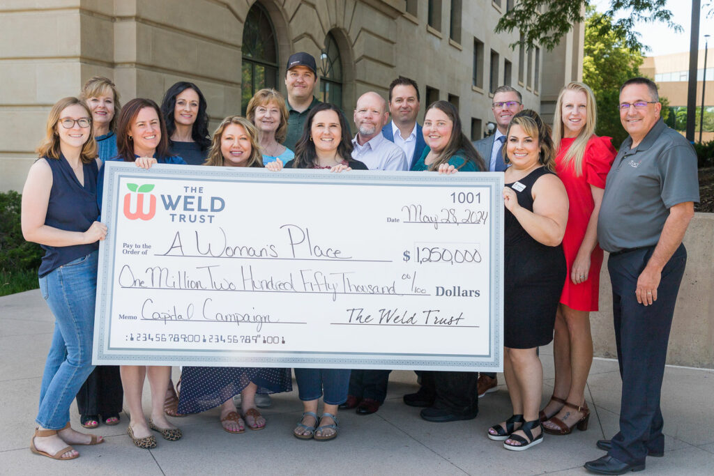 a womans place accepts a grant from the weld trust working together to build a stronger community